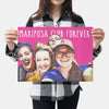 Lady holding her custom Pink Poster with a pop art of her friends