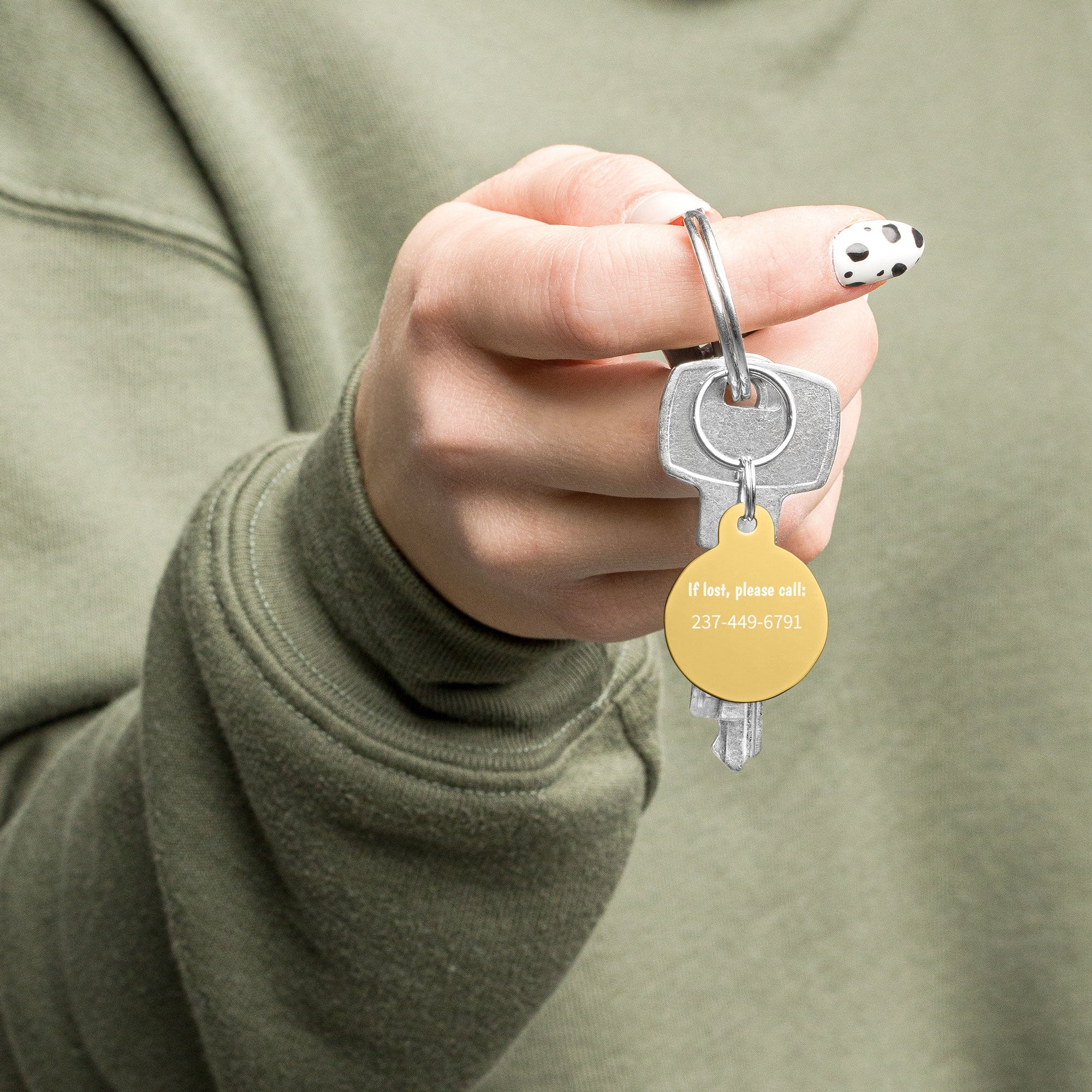 Lady holding a pink poster custom pet tag gold
